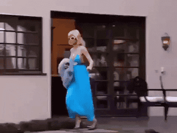 Gif of Paris Hilton running to her car and peeling out of her driveway