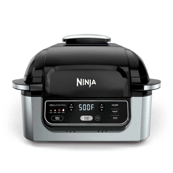 the ninja grill with a lid, chrome handles on the side, a face that shows the degrees to set it to and buttons for operation