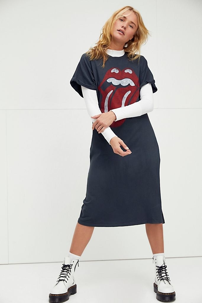 model wearing the black Rolling Stones dress