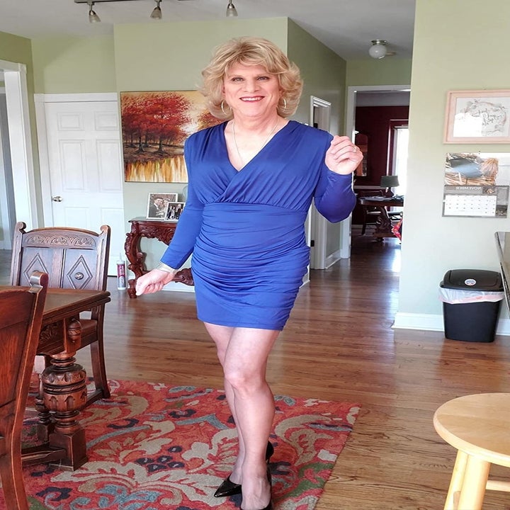 Reviewer wearing the v-neck dress in blue