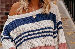 model wearing off the shoulder sweater with a stripe print a wide sleeves