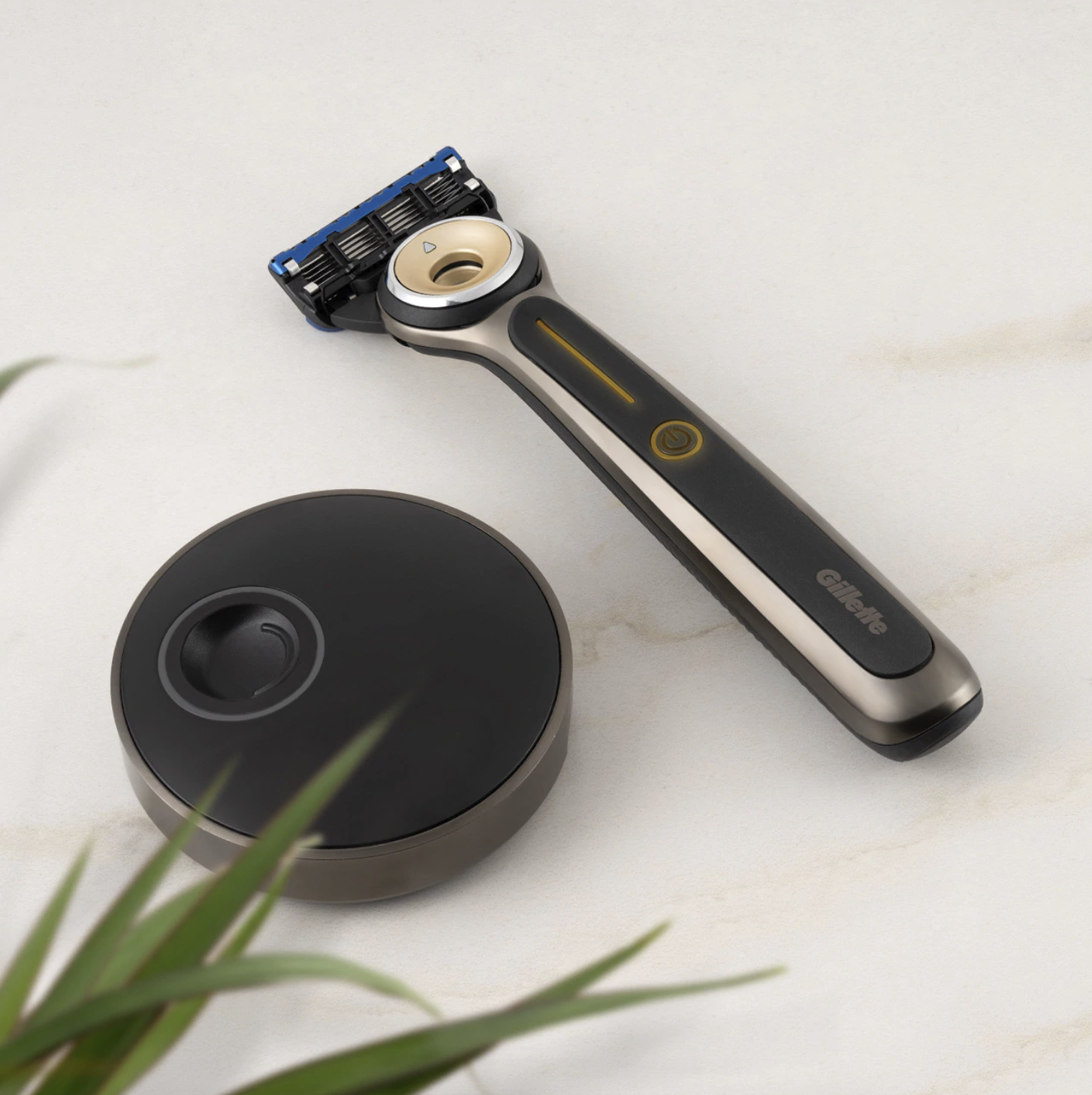 the razor sitting on a marble surface with the circular charging dock