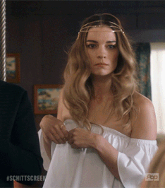 Gif of Alexis Rose from Schitt&#x27;s Creek slapping David Rose on the arm 