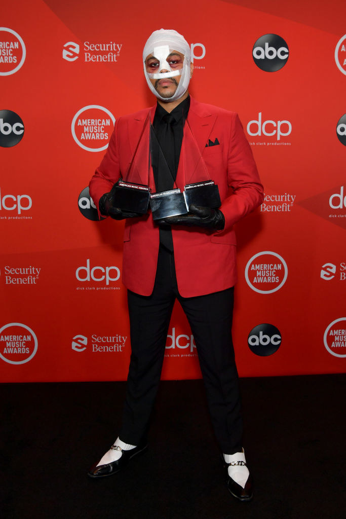 The Weeknd poses with the awards for Favorite Soul/R&amp;amp;B Album, Favorite Soul/R&amp;amp;B Song, and Favorite Soul/R&amp;amp;B Male Artist at the 2020 American Music Awards