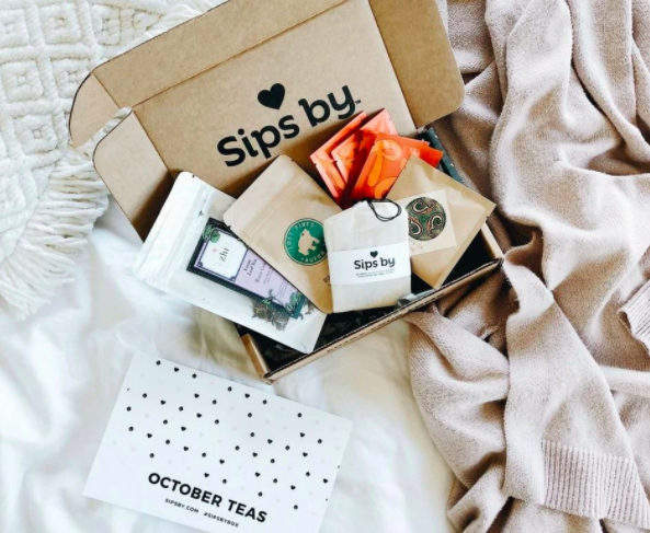 The Sips By subscription box laid out showing all the yummy tea you get