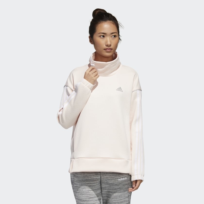 Model wearing cream-colored sweatshirt