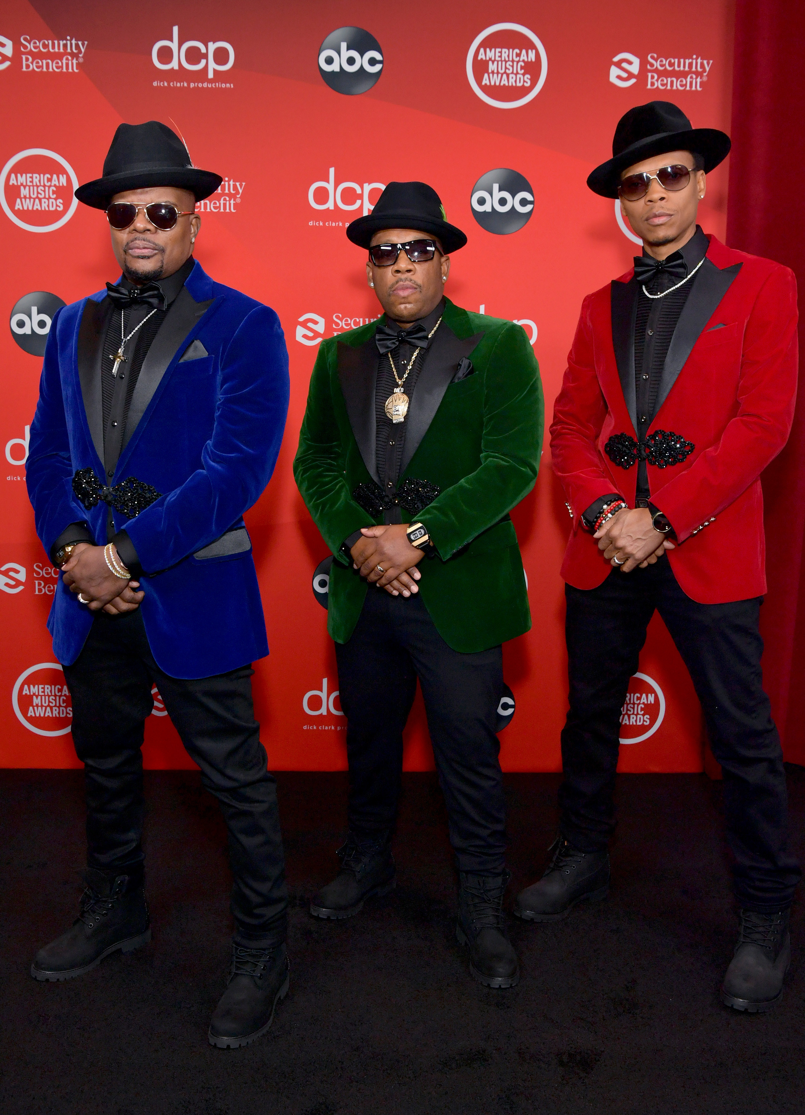 Ricky Bell, Michael Bivins, and Ronnie DeVoe of Bell Biv DeVoe attend the 2020 American Music Awards in coordinating suits