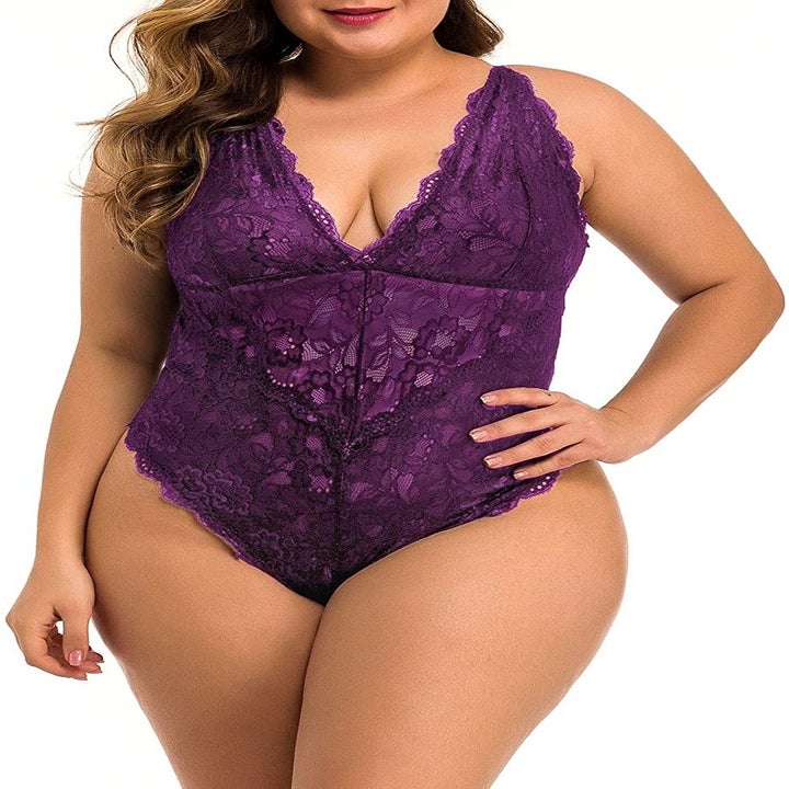 A model wearing the plunging neckline bodysuit in purple