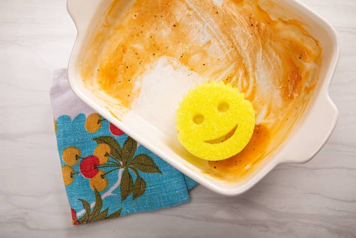 scrub daddy sponge on a dirty casserole dish
