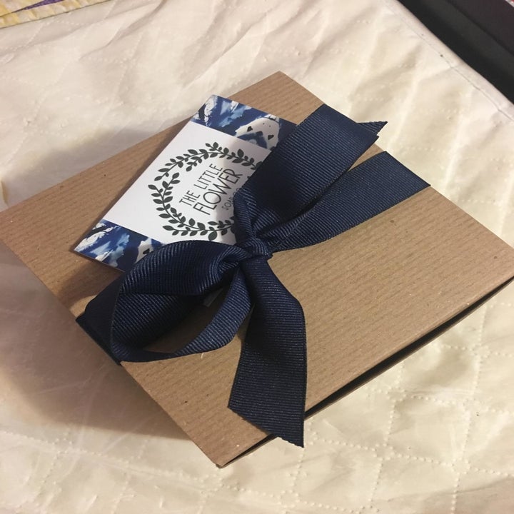 A reviewer's photo of the packaging which comes wrapped in a bow