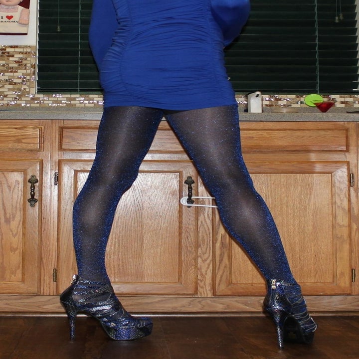A reviewer wearing the blue glitter tights