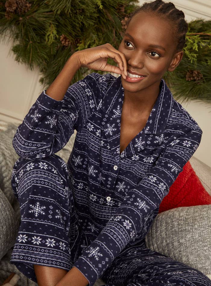 A person wearing holiday fleece pyjamas