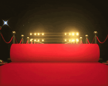 A GIF of a red carpet rollout 