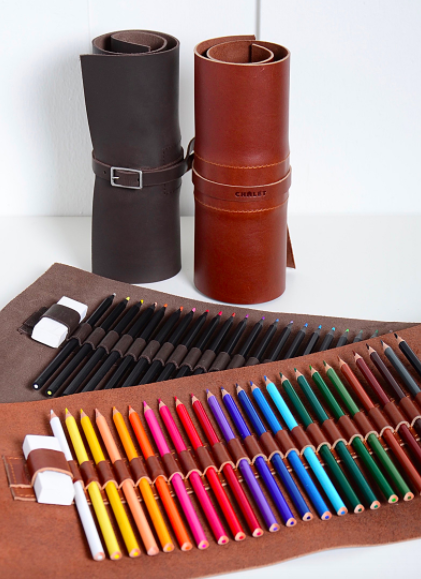 Two leather rolls plus two unravelled ones that show the coloured pencils inside