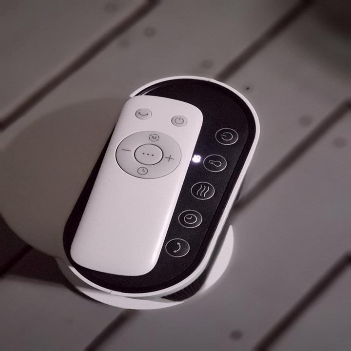 Top-down view of heater control and white remote control