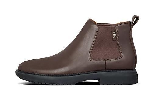 A profile view of a brown leather ankle boot with elasticized gores and a black outsole