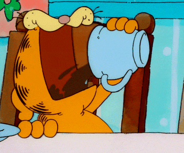 Garfield drinking a cup of coffee very quickly 