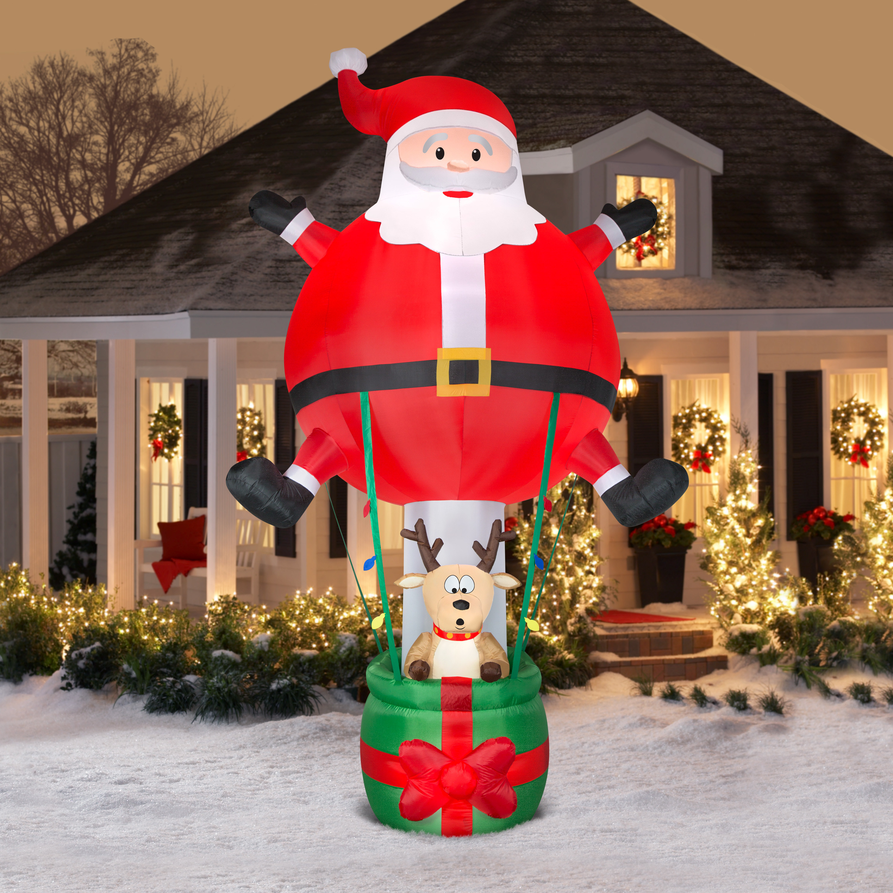 The Santa inflatable placed in front of a house to show its size