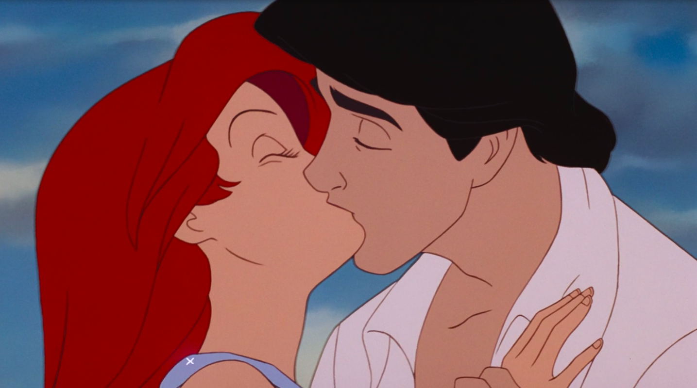 Ariel and Eric kiss. 