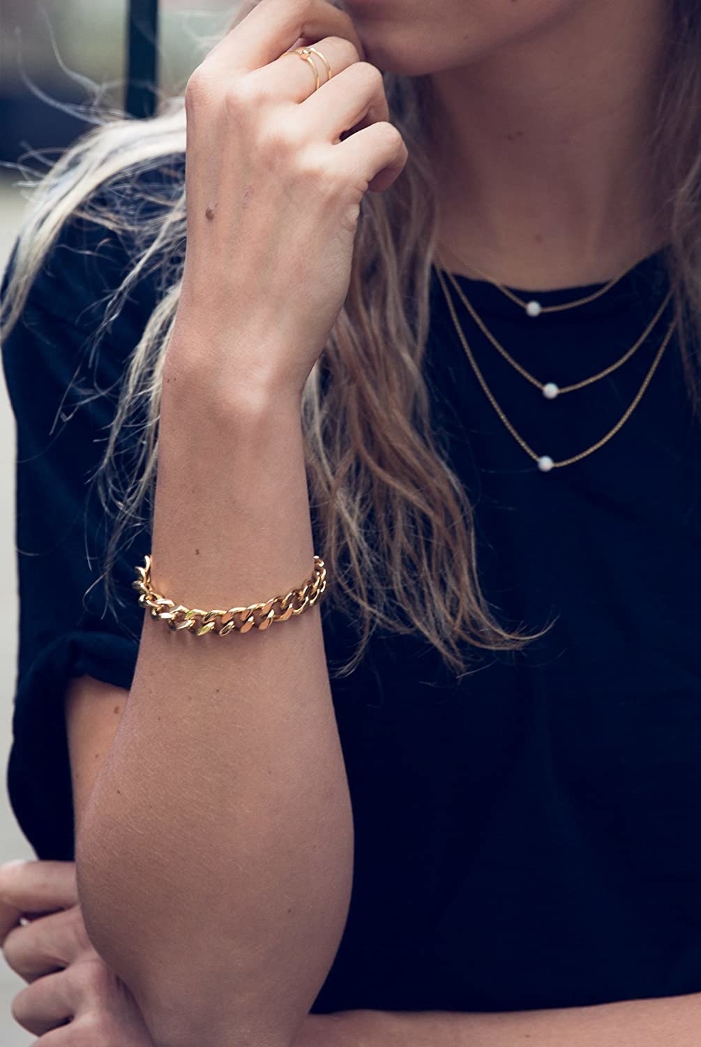 model wearing the gold chain bracelet