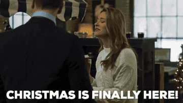 gif of a woman saying &quot;Christmas is finally here!&quot; 