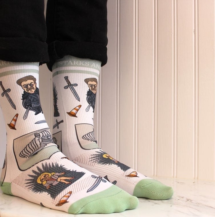 A person wearing the socks with rolled up pants