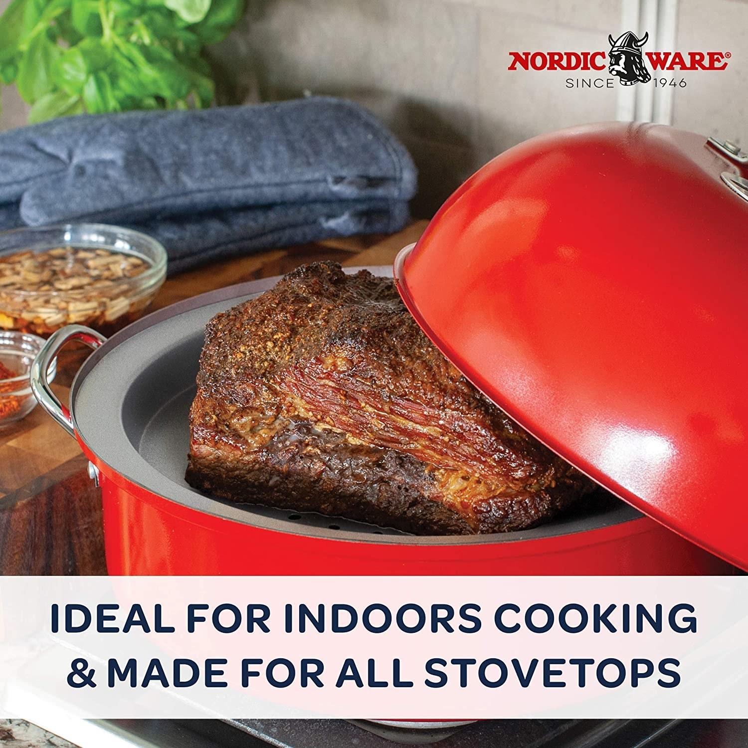 The red cooker with meat inside and text &quot;idea for indoors cooking and made for all stovetops&quot;