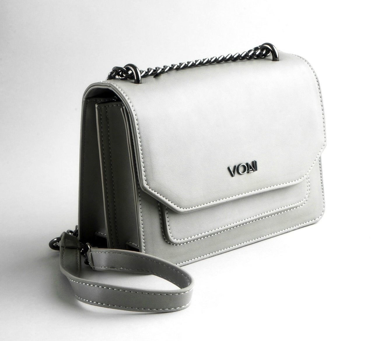 The rectangle-shaped handbag with a silver metal chain strap with a soft part in the center and a front flap, two inner compartments, and front-slip pocket in grey