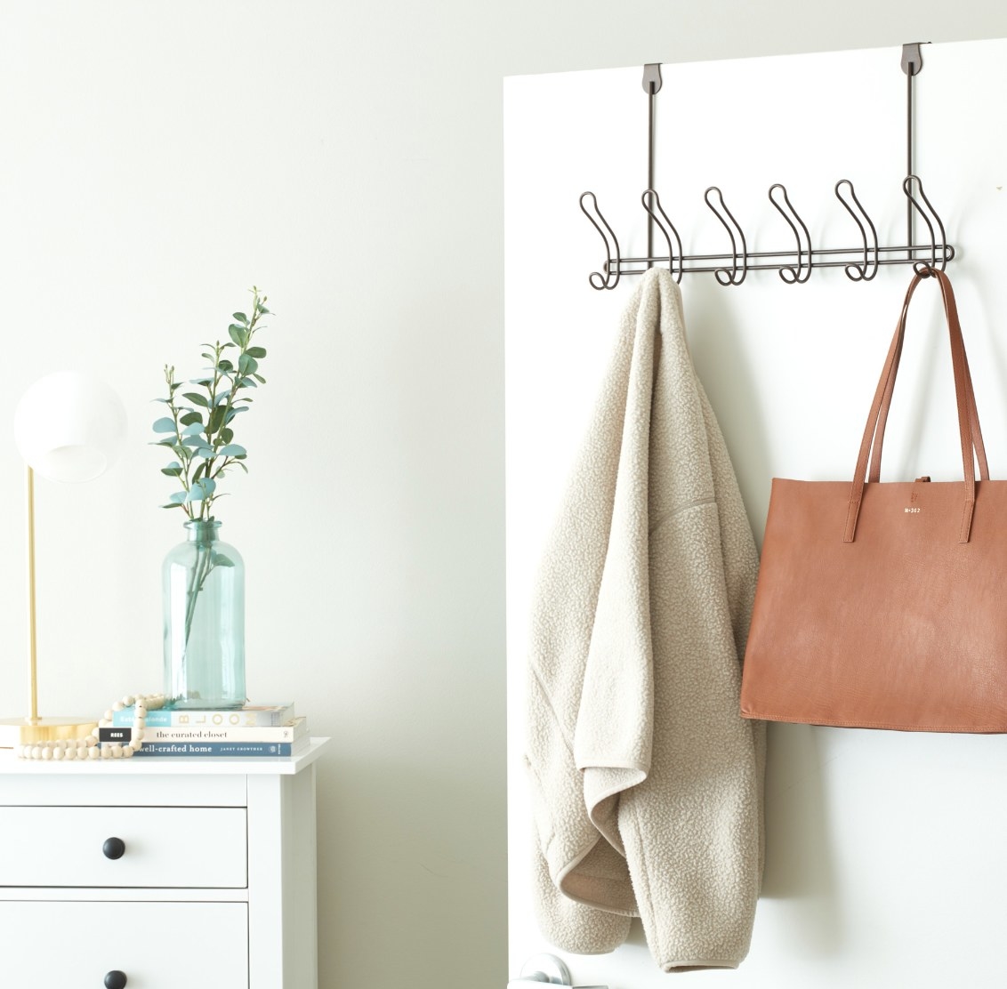 The over-the-door coat rack in bronze