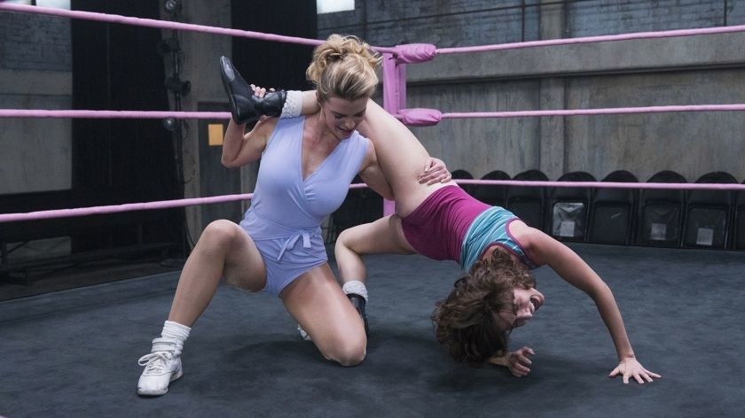 Alison Brie as Ruth Wilder getting tossed in the ring