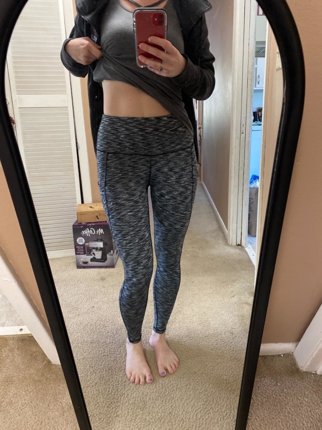 Reviewer wearing leggings in the shade space dye gray