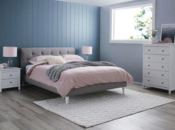 Queen Bed decorated with soft tones and textured blankets to looks cosy and inviting