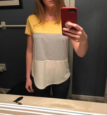 Reviewer wearing yellow color-block T-shirt