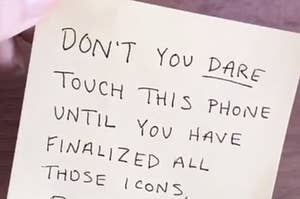 A post it note that says "don't you dare touch this phone until you have finalized all those icons"