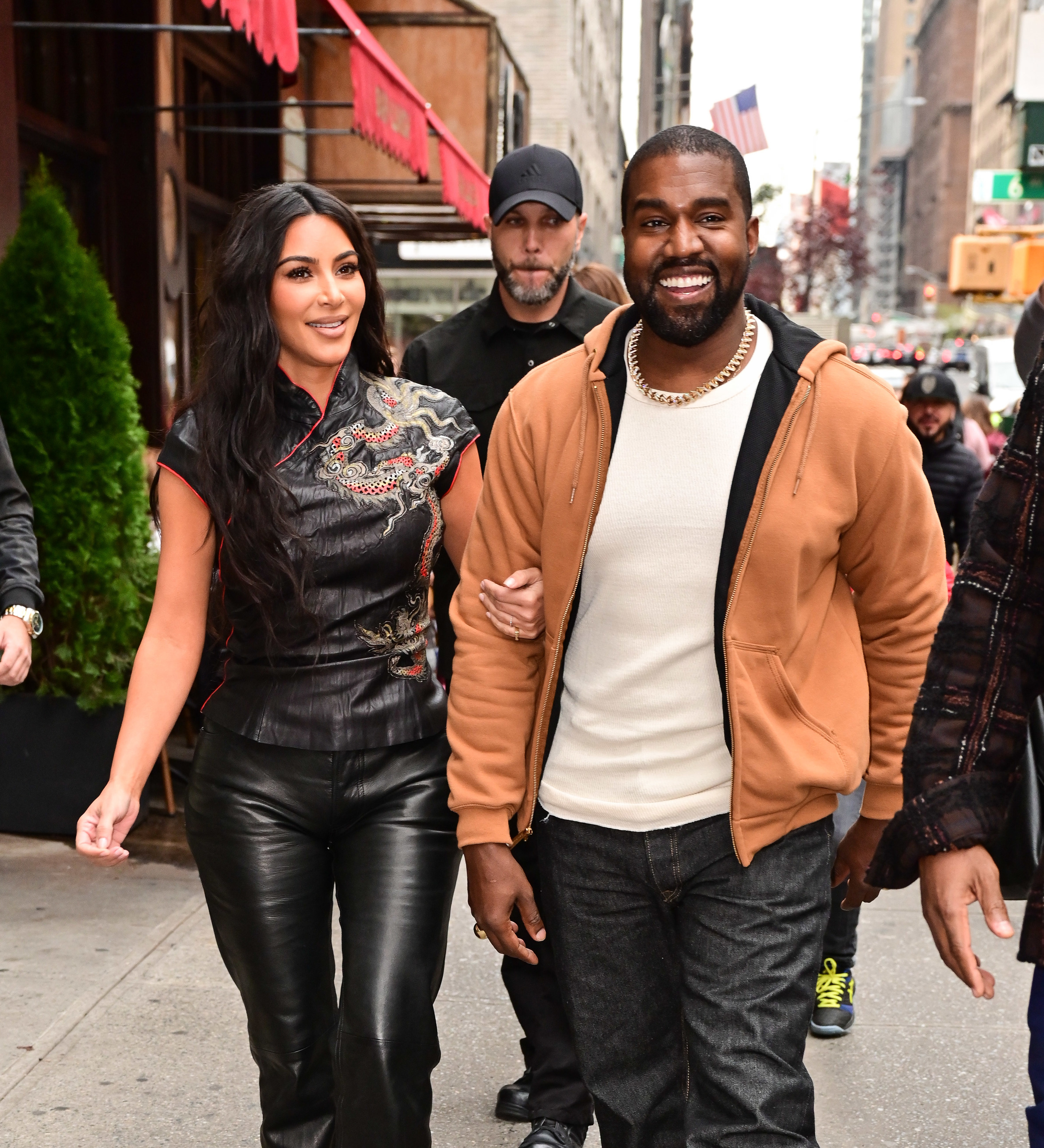 Kim Kardashian West and Kanye West walk along 57th Street on October 25, 2019 in New York City