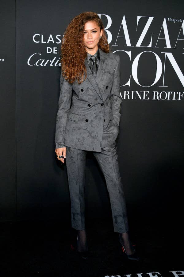 Zendaya in a floral patterned double-breasted suit with a tie and button up beneath