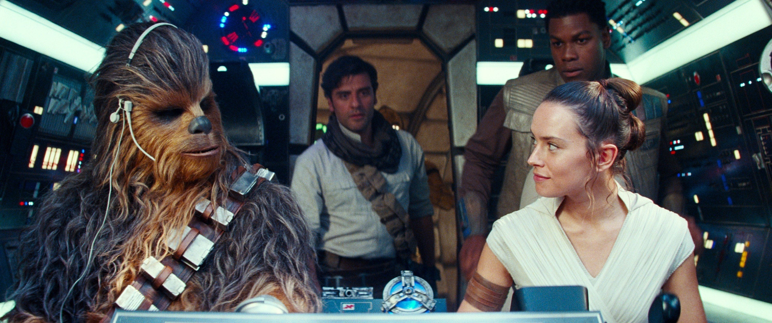 Joonas Suotamo as Chewbacca, Daisy Ridley as Rey; background from left: Oscar Isaac as Poe Dameron, John Boyega as Finn