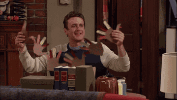 Marshall holds up a paper chain of turkeys on How I Met Your Mother