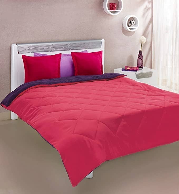 Pink and purple reversible comforter.