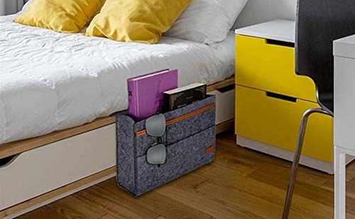 Grey bedside caddy with compartments.
