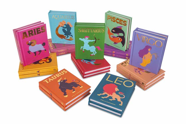 The books, with foil titles of the zodiac signs plus colorful illustration representing the sign, each book in a different color