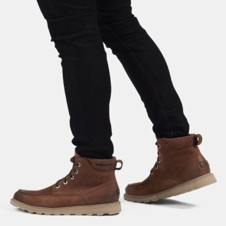 a model wearing men's brown winter boots