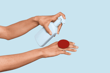 gif of a model pumping facial cleanser onto a Boie face scrubber