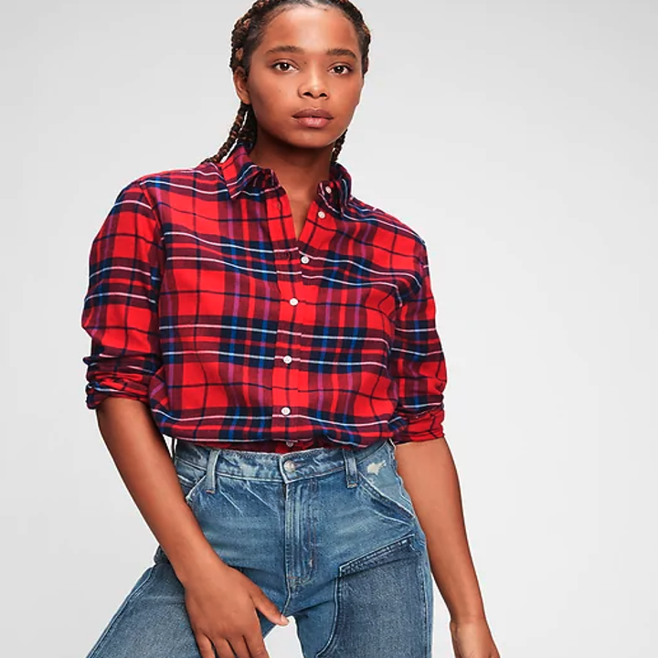 Model wearing  a red plaid flannel shirt