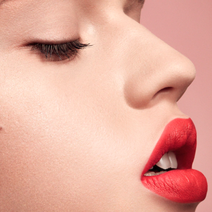 A model wearing Fenty lipstick