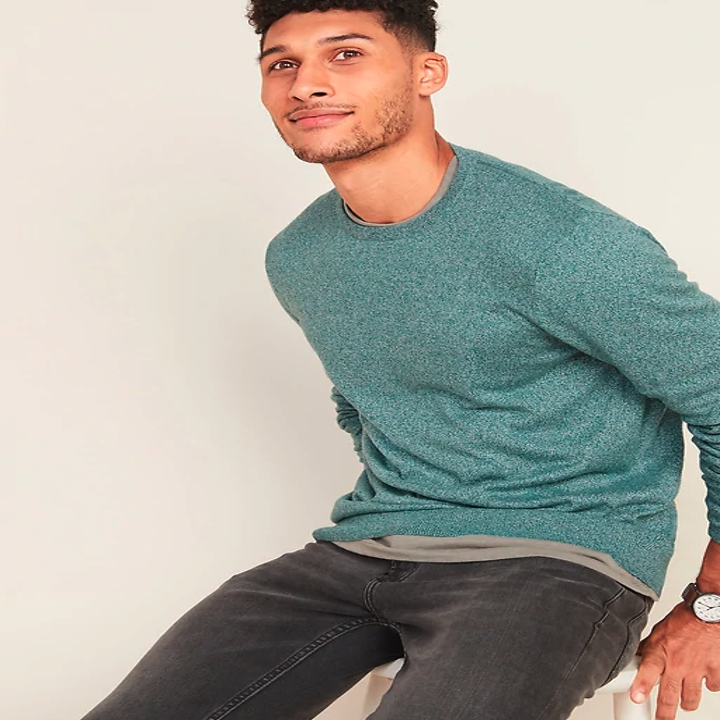 Model wearing a teal sweater