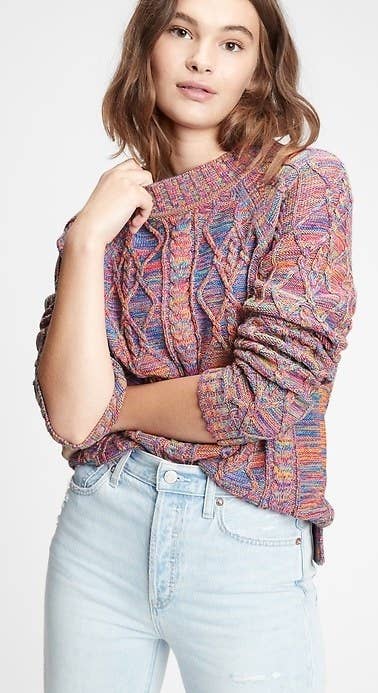 Model wearing multi-color sweater