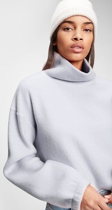 model wearing grey fleece turtleneck