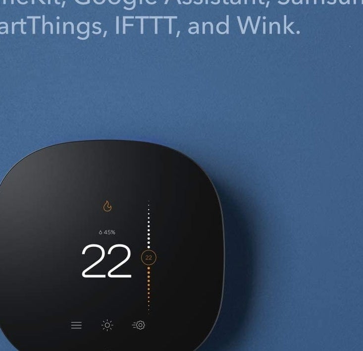 A smart thermostat mounted on a wall
