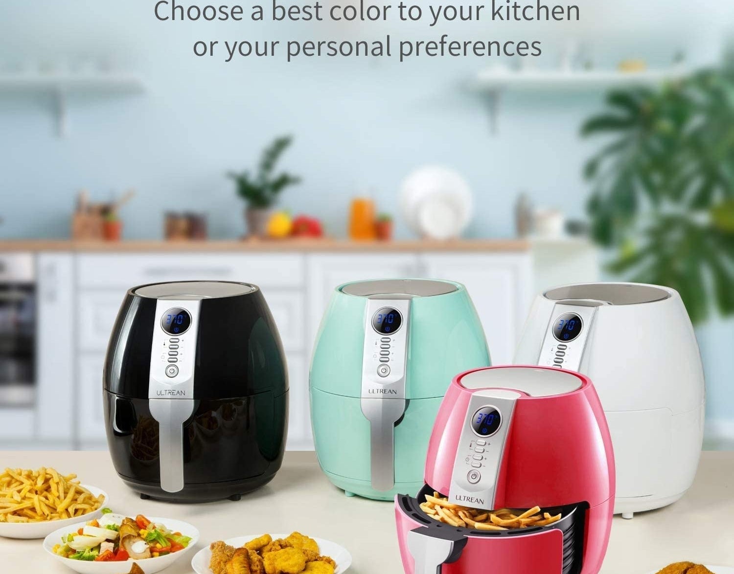 A set of four air fryers in varying colours arranged on a counter